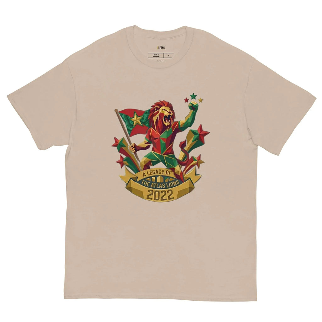 Beige t-shirt with geometric lion holding flag, stars, and 'A Legacy of The Atlas Lions 2022' banner, sports fan apparel