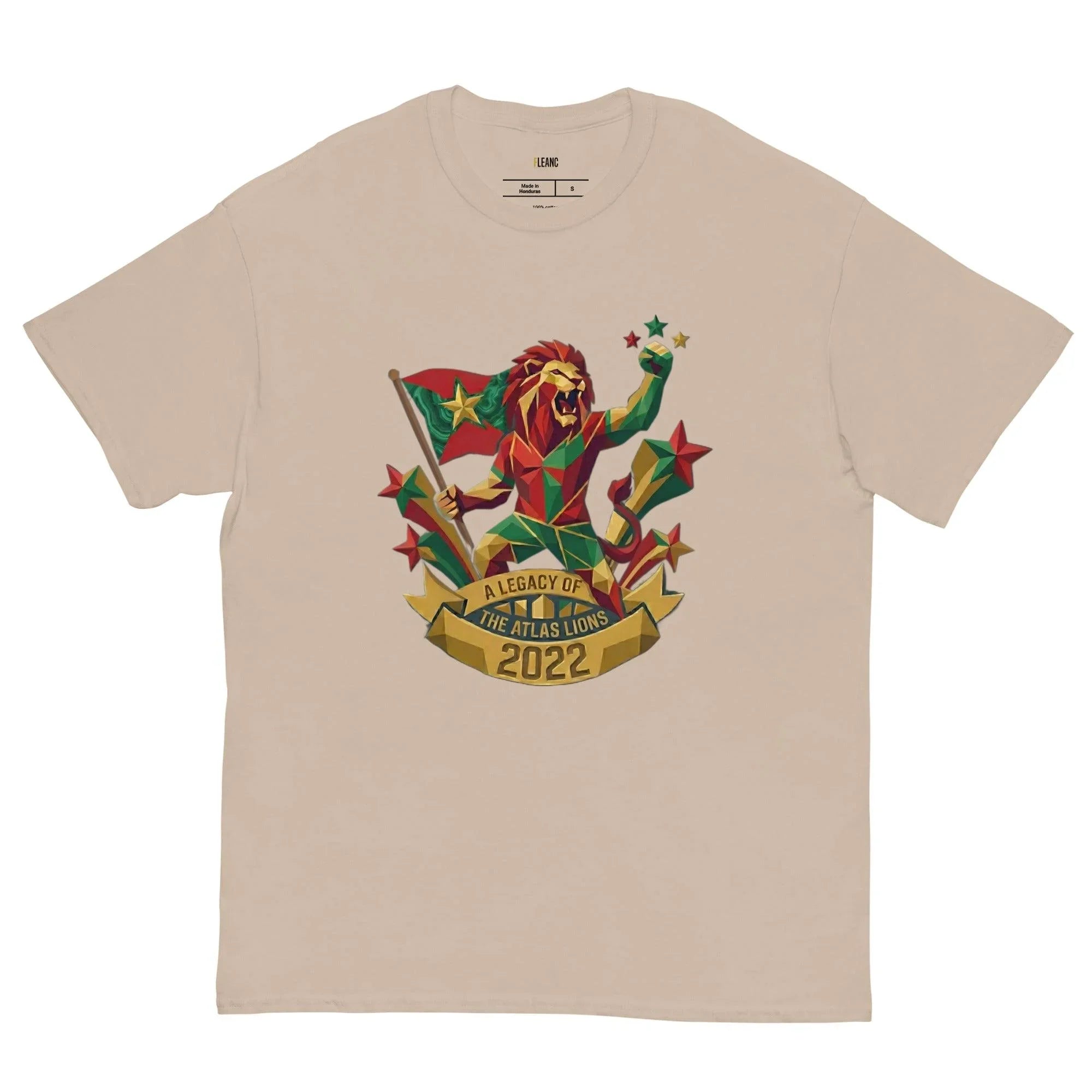Beige t-shirt with geometric lion holding flag, stars, and 'A Legacy of The Atlas Lions 2022' banner, sports fan apparel