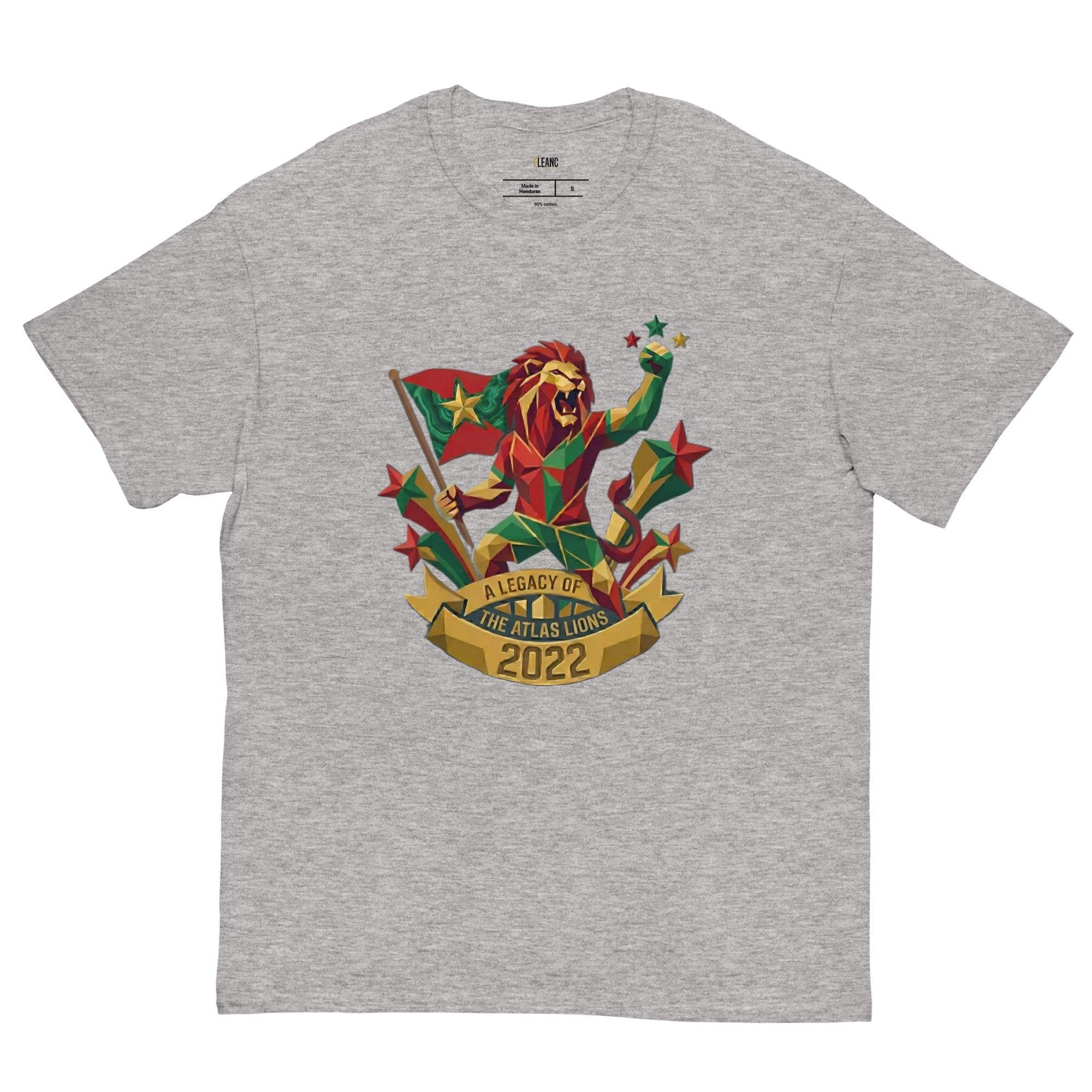 Gray t-shirt with geometric lion holding flag, stars, and 'A Legacy of The Atlas Lions 2022' banner, sports fan apparel